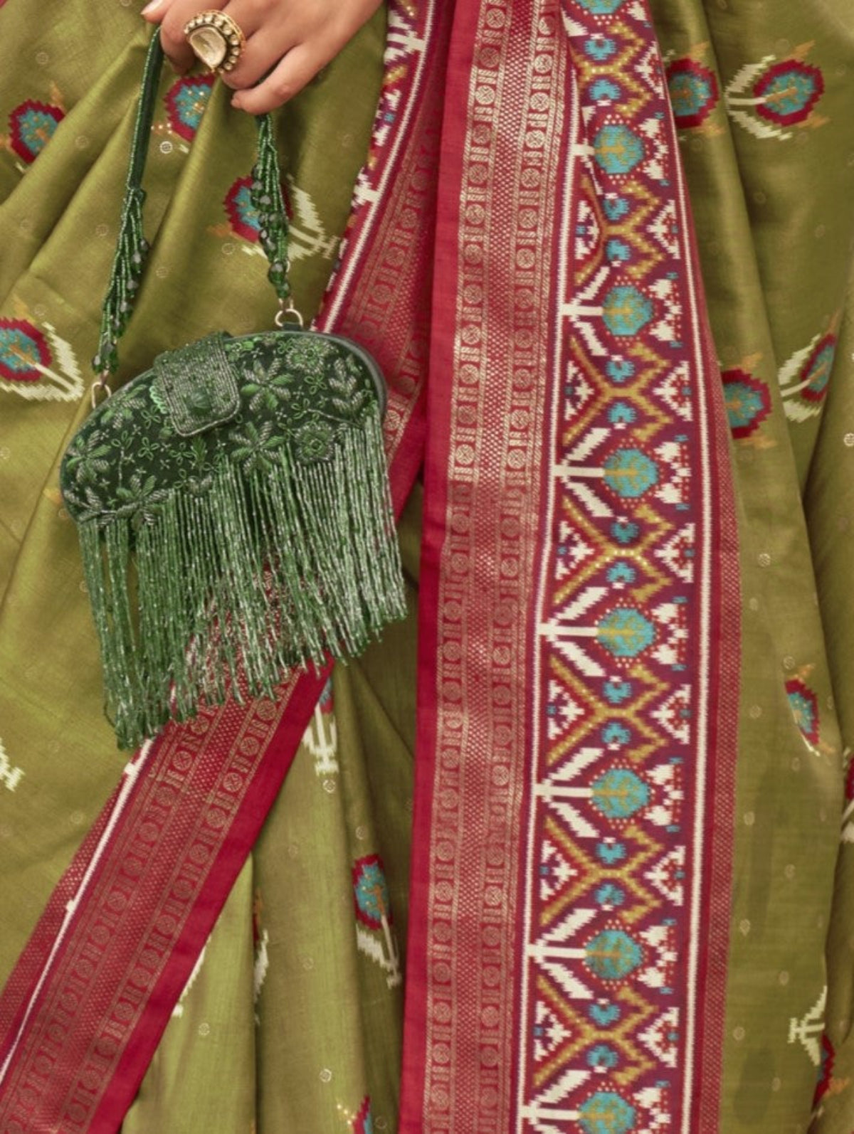 Shop Olive Green Patola Silk Saree for Wedding at STORI