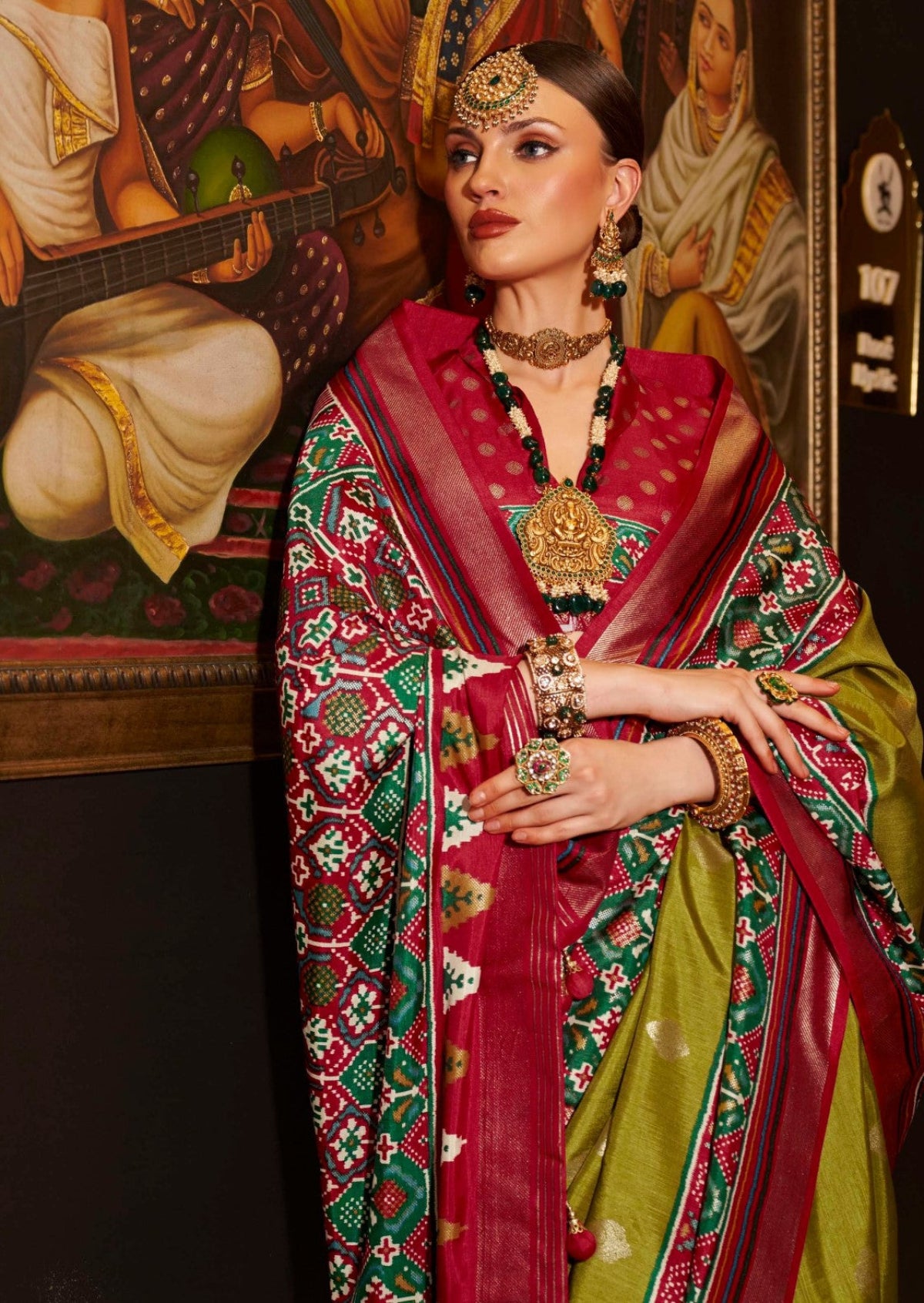 Shop Olive Green Patola Silk Saree for Wedding at STORI