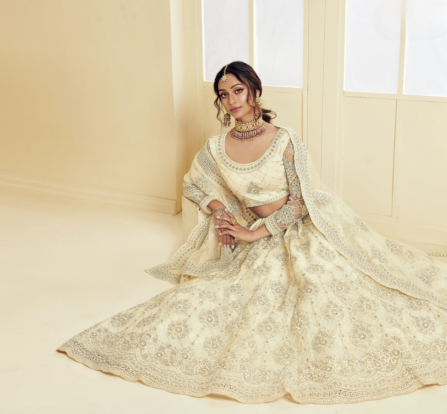 Cream White Heavy Embroidered Net Lehenga