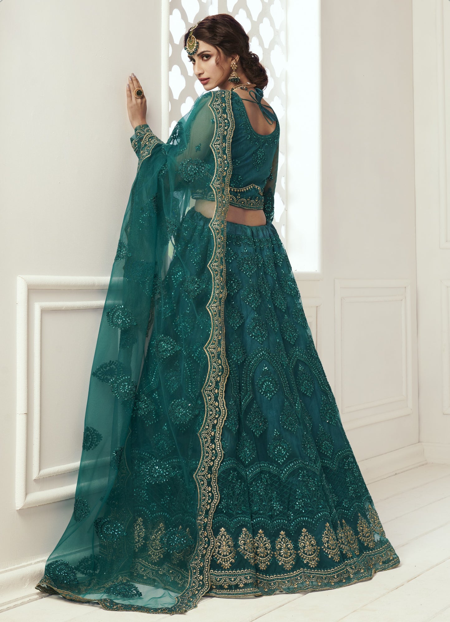 Teal Green Heavy Embroidered Net Bridal Lehenga