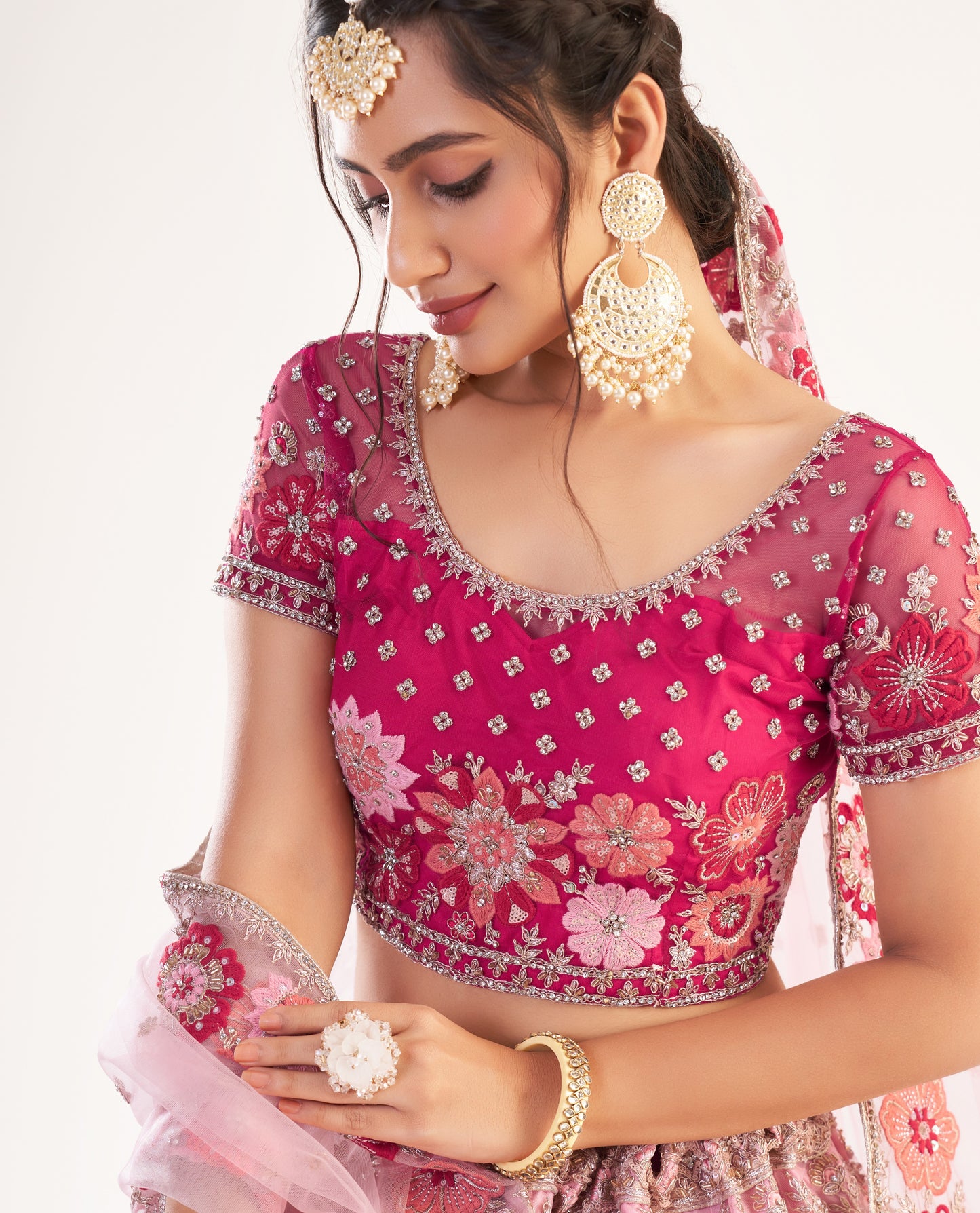 Magenta Pink Heavy Embroidered Net Bridal Lehenga