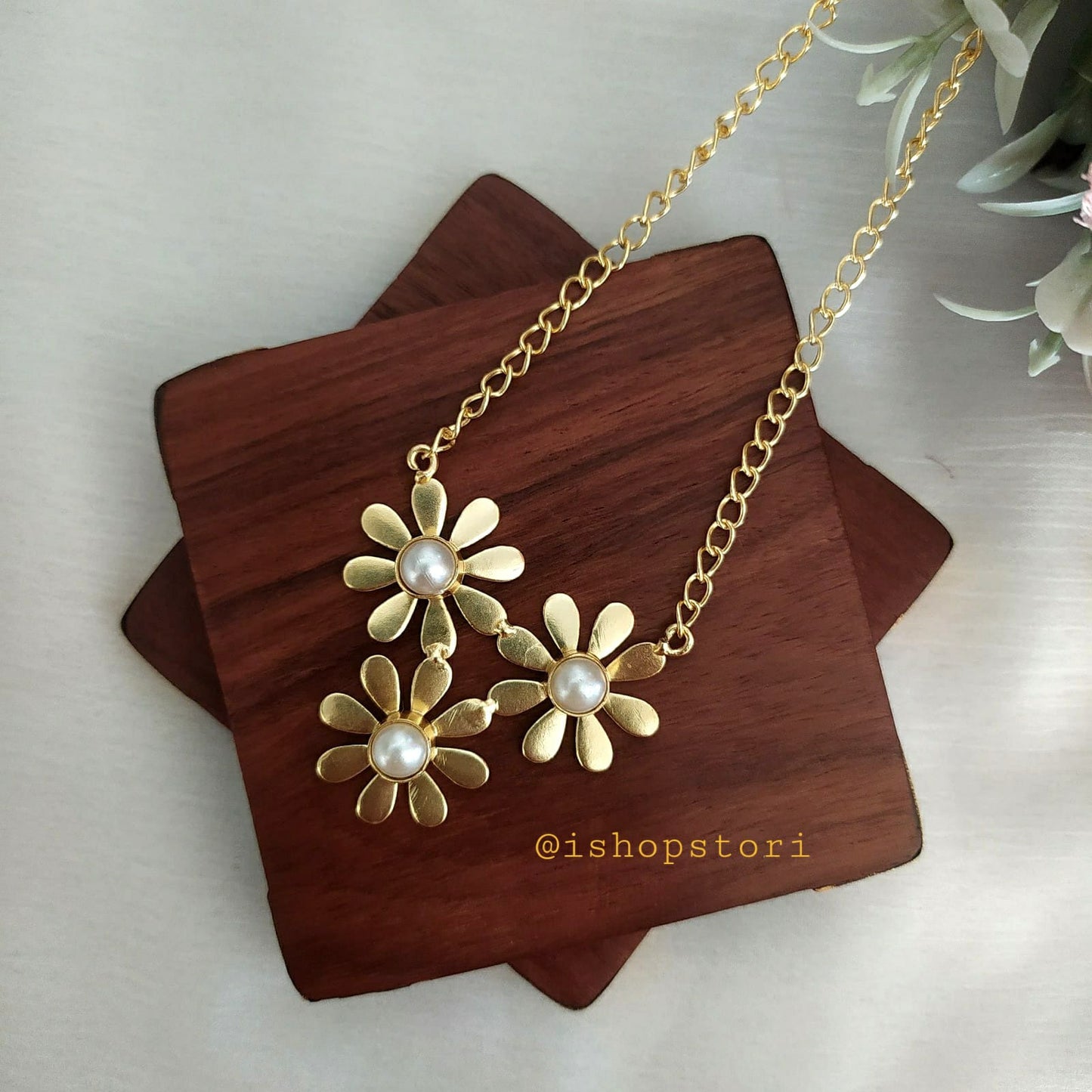Golden pearl chain with an elegant finish.