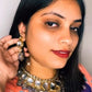 Purple kundan necklace set in a grape-inspired shade with earrings.
