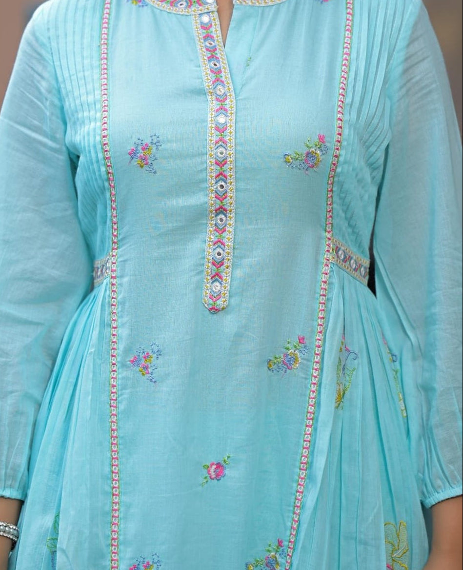 Light blue dress with intricate embroidery on a plain background