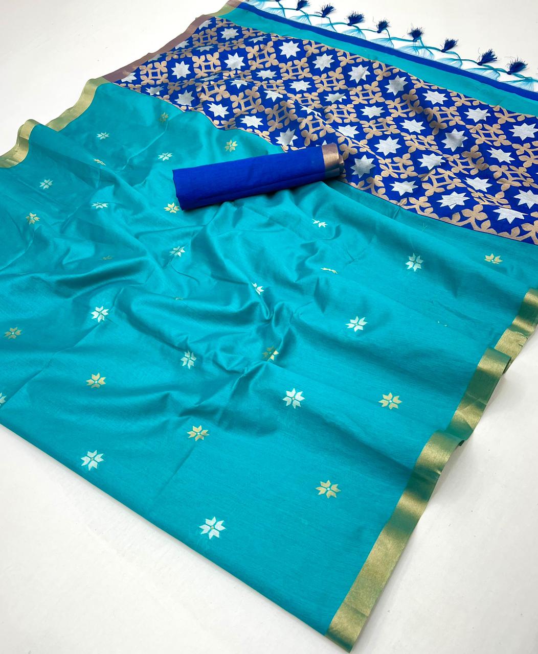 Turquoise saree with floral patterns and a blue blouse on a white background