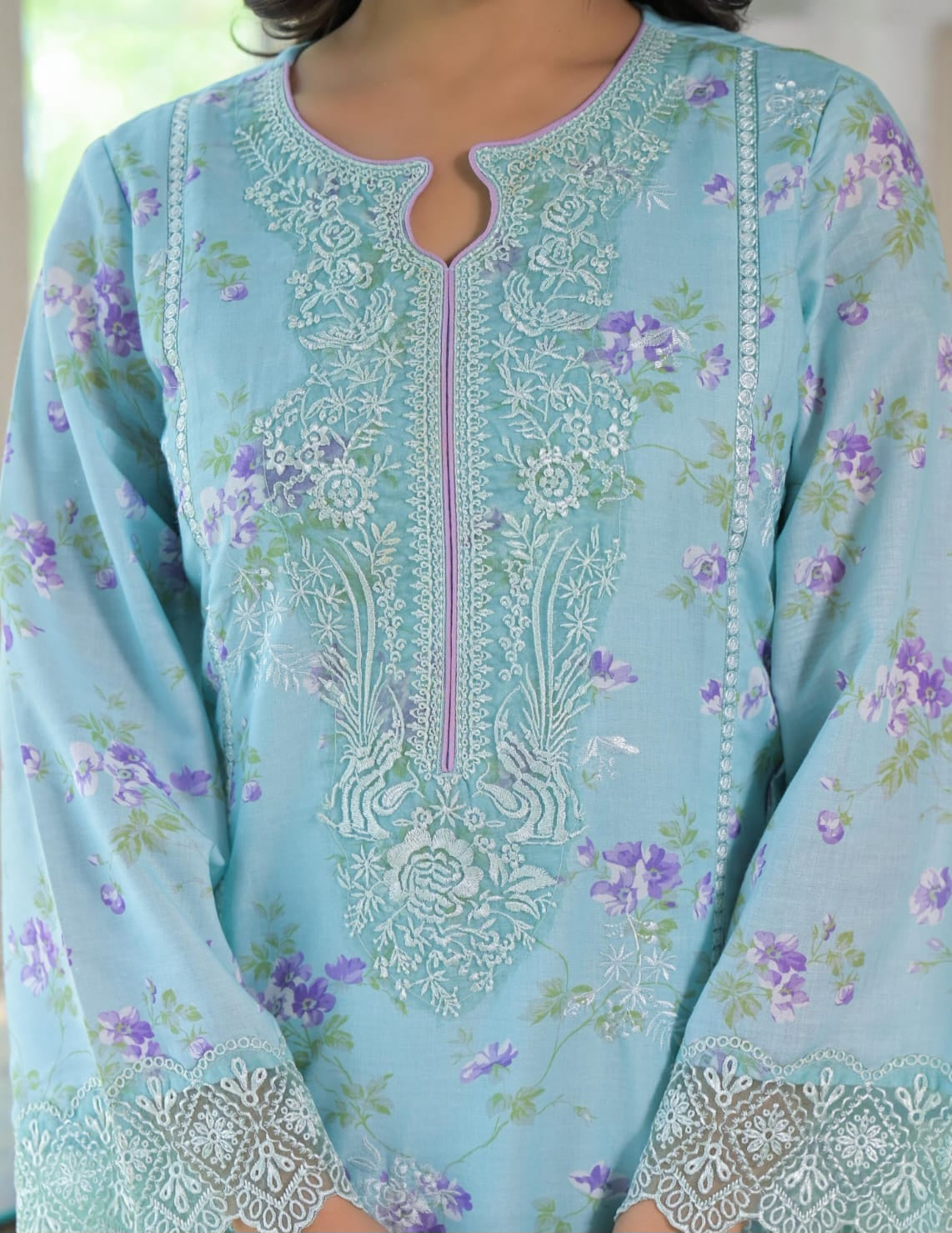 Light blue embroidered dress with floral patterns