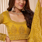 Turmeric Yellow Heavy Embroidered Net Lehenga