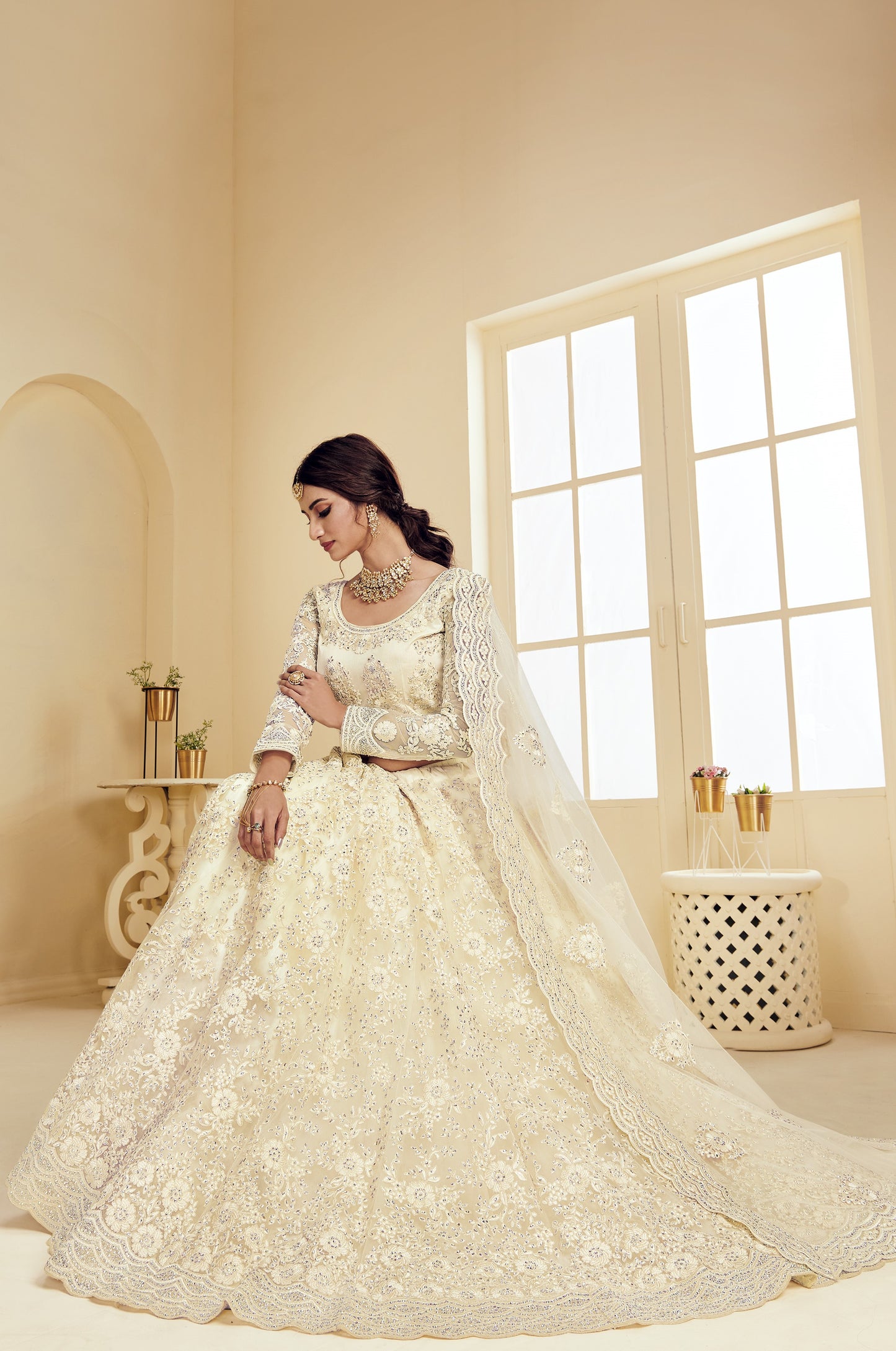 Ivory White Heavy Embroidered Net Lehenga