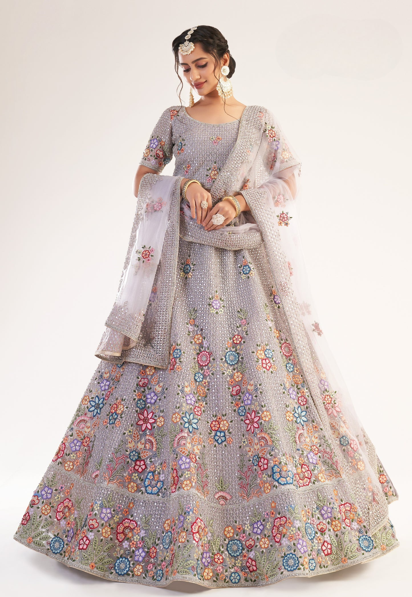 Dusky Lavendar Heavy Embroidered Net Bridal Lehenga