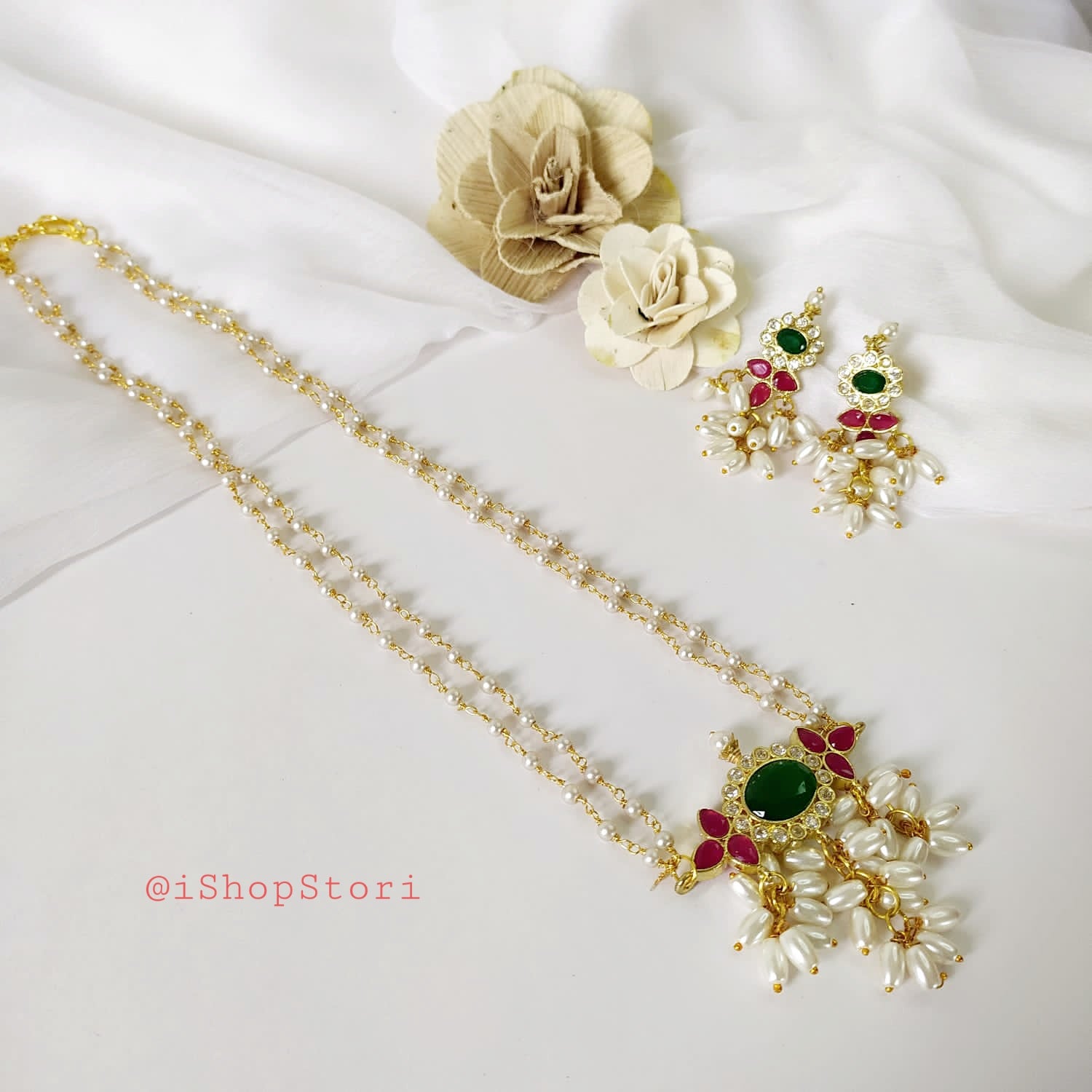 Two-string real pearl necklace in red and green shades with earrings.