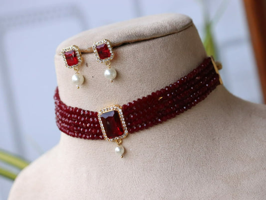 Glossy stone and crystals gold choker necklace set.