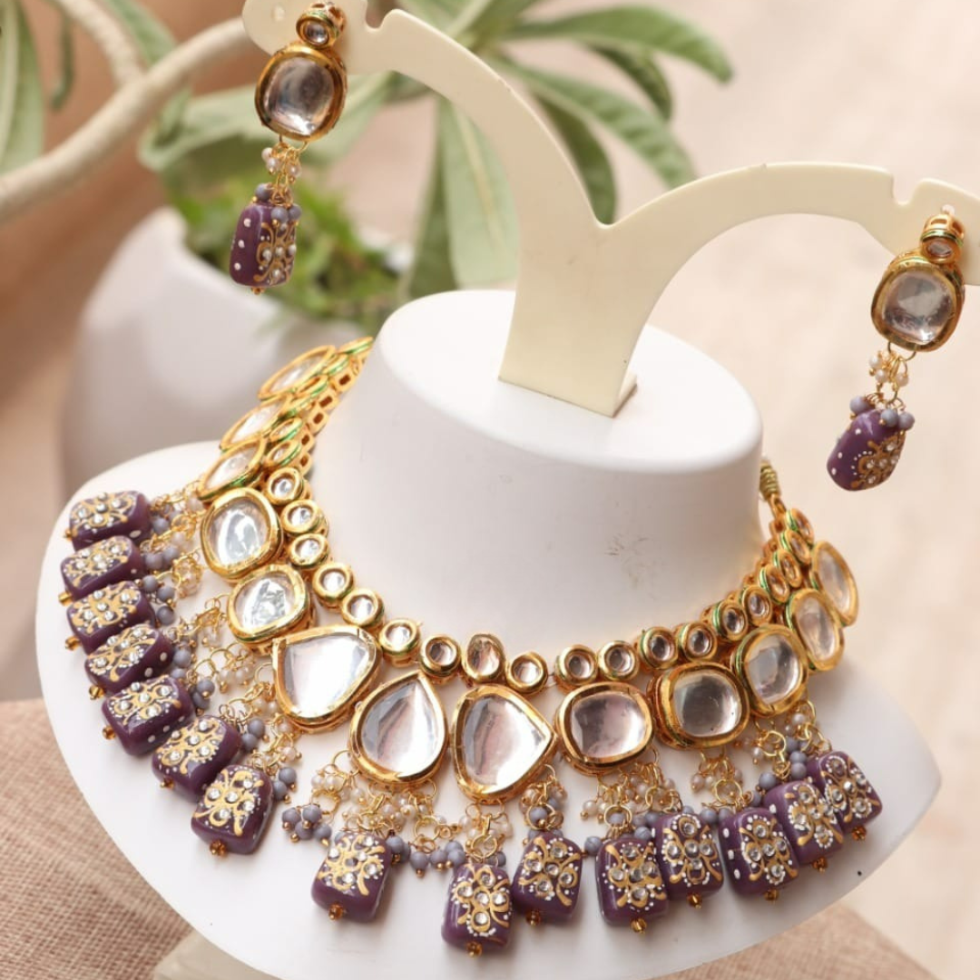 Purple kundan necklace set in a grape-inspired shade.
