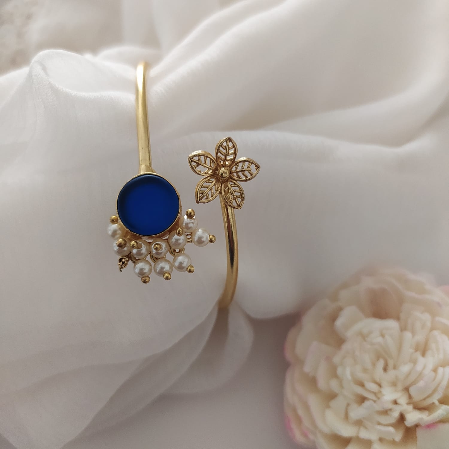 A sleek Cartier bracelet with a classic, polished design, symbolizing luxury and elegance.