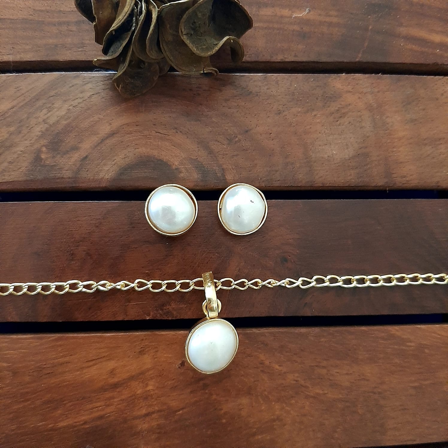 Baroque pearls and diamond necklace set with matching earrings.