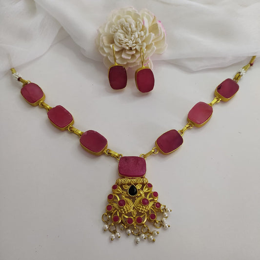 Pink quartz statement necklace set with a timeless design full view.
